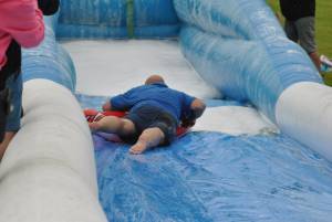 Ilminster Town FC fun day Part 33 – July 9, 2016: A giant water slide was the star attraction at a family fun day held to celebrate Ilminster Town Football Club’s new Archie Gooch Pavilion headquarters in Britten’s Field. Photo 24