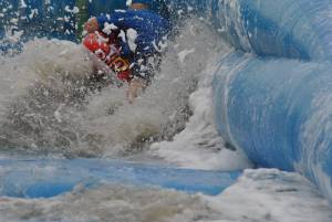 Ilminster Town FC fun day Part 33 – July 9, 2016: A giant water slide was the star attraction at a family fun day held to celebrate Ilminster Town Football Club’s new Archie Gooch Pavilion headquarters in Britten’s Field. Photo 25