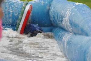 Ilminster Town FC fun day Part 33 – July 9, 2016: A giant water slide was the star attraction at a family fun day held to celebrate Ilminster Town Football Club’s new Archie Gooch Pavilion headquarters in Britten’s Field. Photo 26