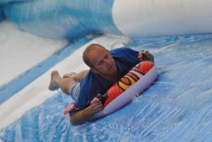 Ilminster Town FC fun day Part 35 – July 9, 2016: A giant water slide was the star attraction at a family fun day held to celebrate Ilminster Town Football Club’s new Archie Gooch Pavilion headquarters in Britten’s Field. Photo 24