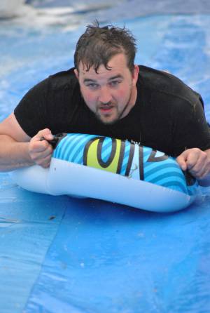 Ilminster Town FC fun day Part 35 – July 9, 2016: A giant water slide was the star attraction at a family fun day held to celebrate Ilminster Town Football Club’s new Archie Gooch Pavilion headquarters in Britten’s Field. Photo 35