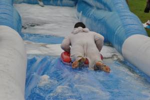 Ilminster Town FC fun day Part 35 – July 9, 2016: A giant water slide was the star attraction at a family fun day held to celebrate Ilminster Town Football Club’s new Archie Gooch Pavilion headquarters in Britten’s Field. Photo 5