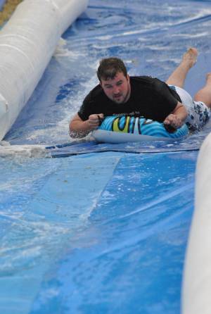 Ilminster Town FC fun day Part 35 – July 9, 2016: A giant water slide was the star attraction at a family fun day held to celebrate Ilminster Town Football Club’s new Archie Gooch Pavilion headquarters in Britten’s Field. Photo 9